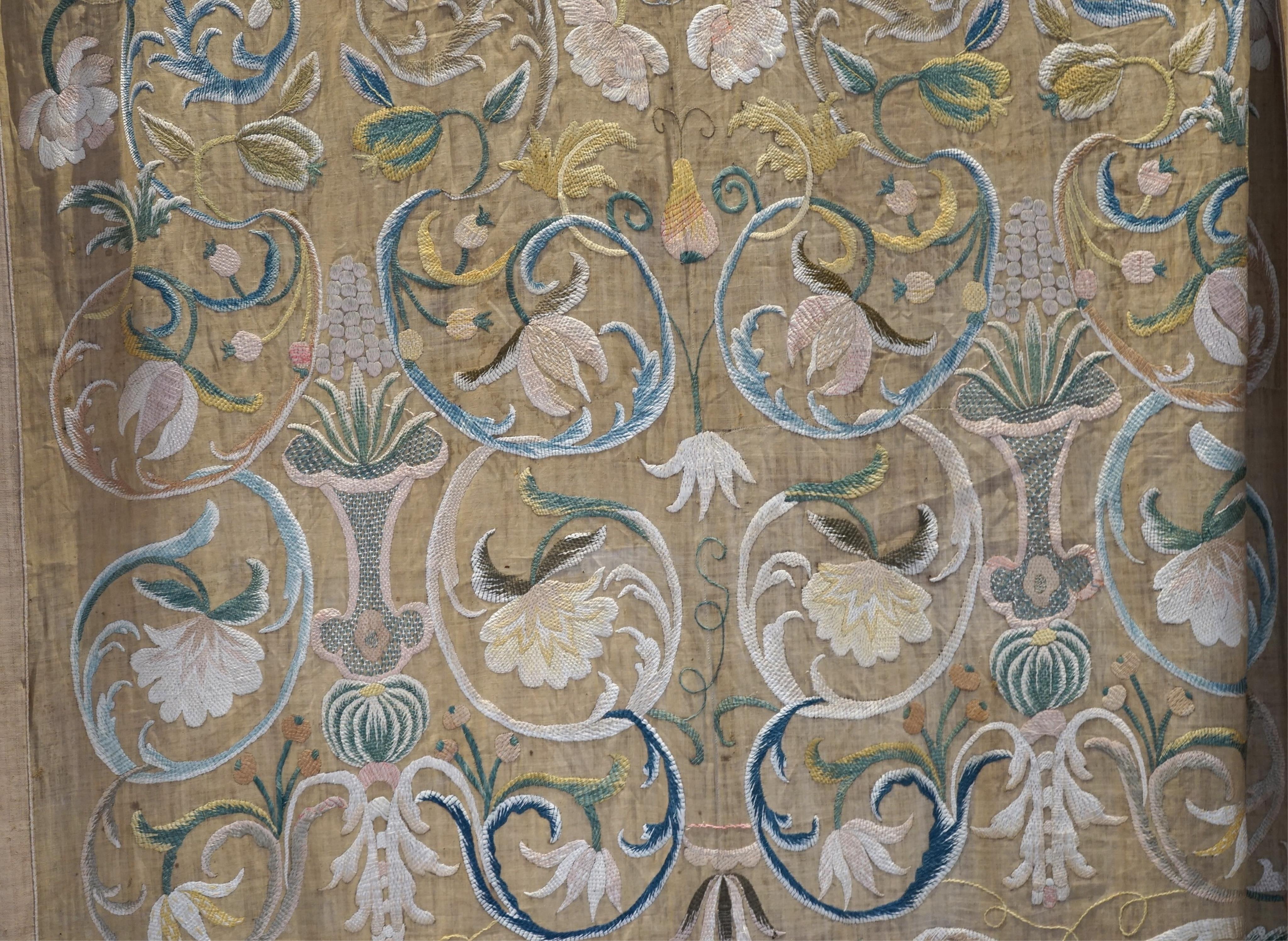 A large pair and one smaller panel of late 18th century Italian silk floss hand embroidered panels, possibly from Florence or Venice, both known for floss embroidery. Thought to be originally sacristy hangings. Elaborate